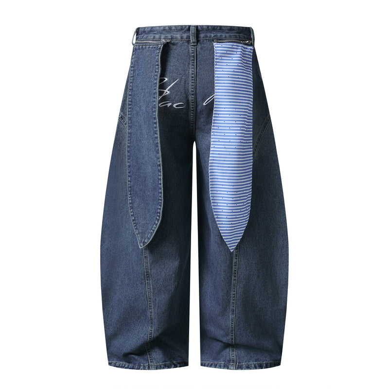 Blue wide-leg jeans with striped front panel and script detail, front view