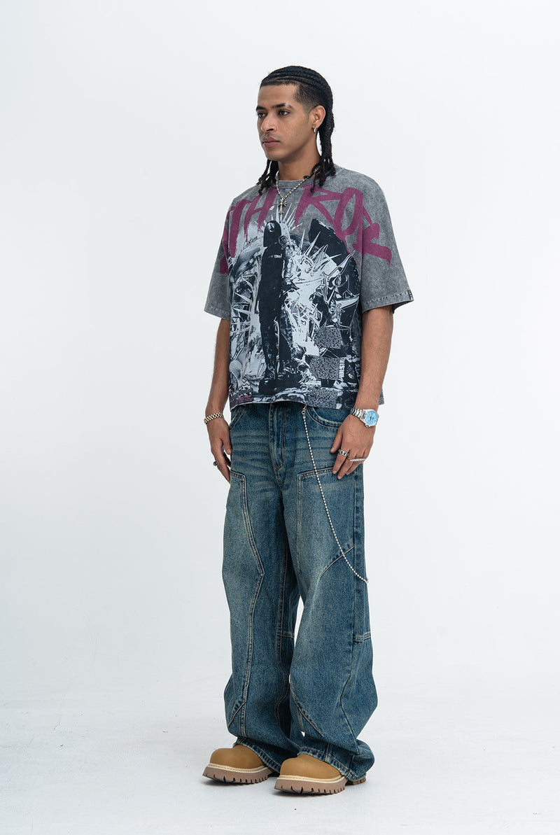 Gray oversized vintage wash goth graphic tee with magenta print, worn with wide-leg denim jeans and tan boots