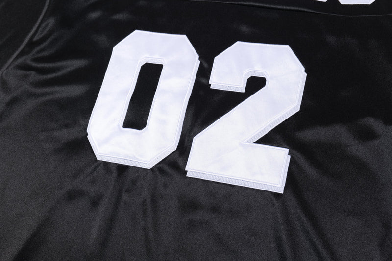 Black mesh football jersey with oversized white varsity patch number 02 on the front