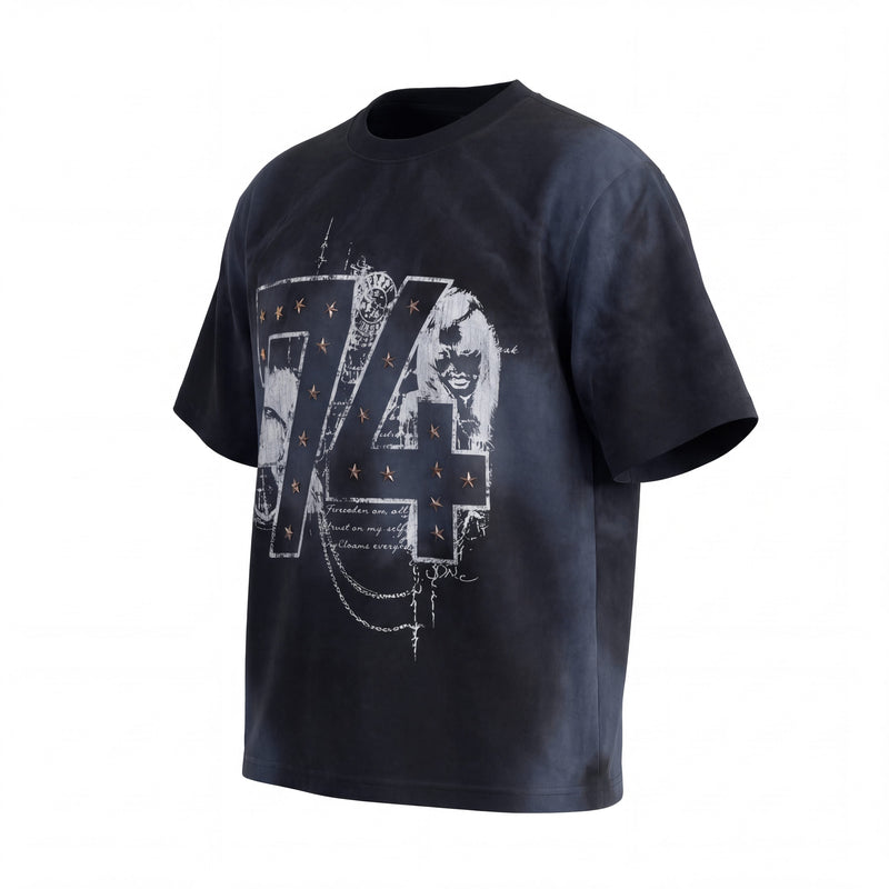 Black vintage wash graphic tee with large distressed 74 print, star accents, and relaxed streetwear fit