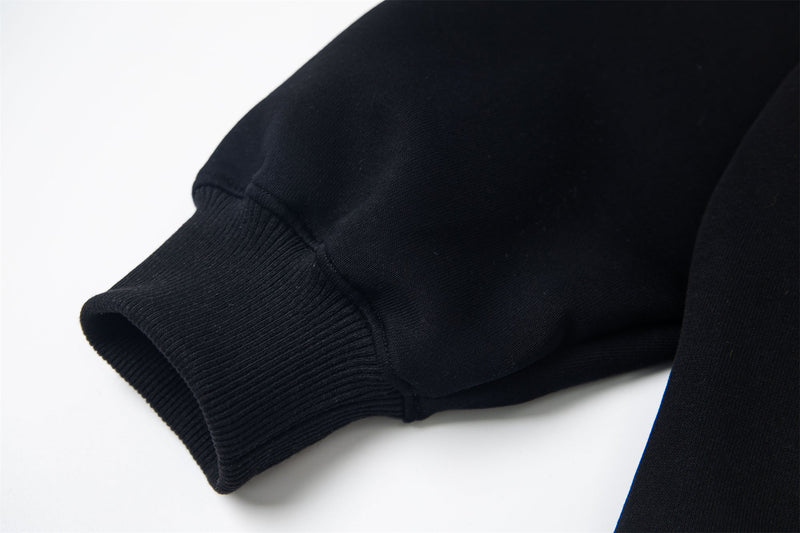 Close-up of black hoodie ribbed cuff and sleeve hem