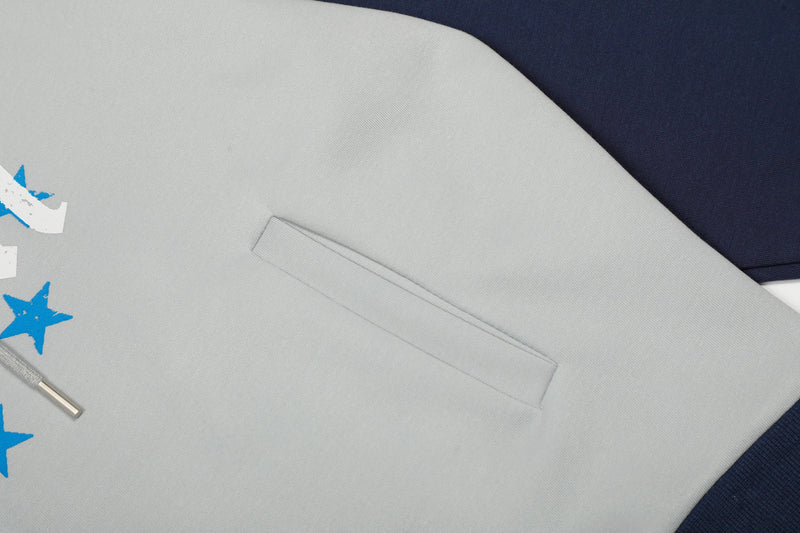 Close-up of front pocket on light gray hoodie body