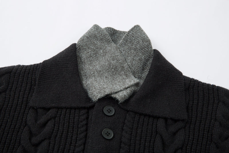 Close-up of black sweater collar with gray contrast collar and button placket