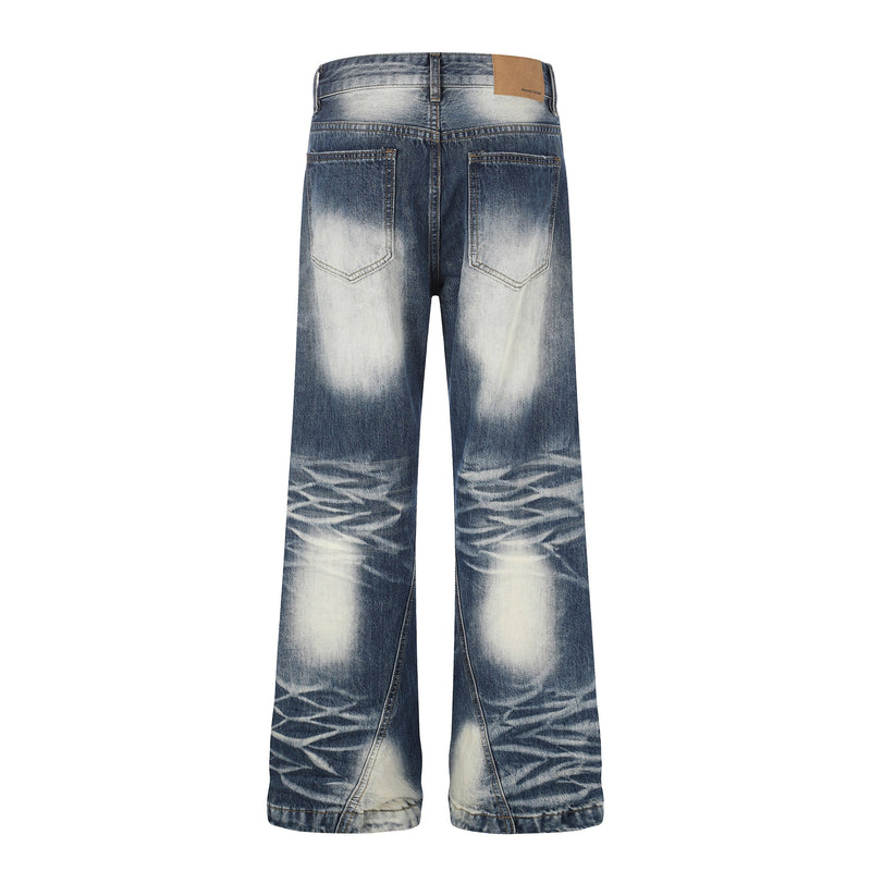 Back view of faded blue wide-leg jeans with patch label and light whiskered wash