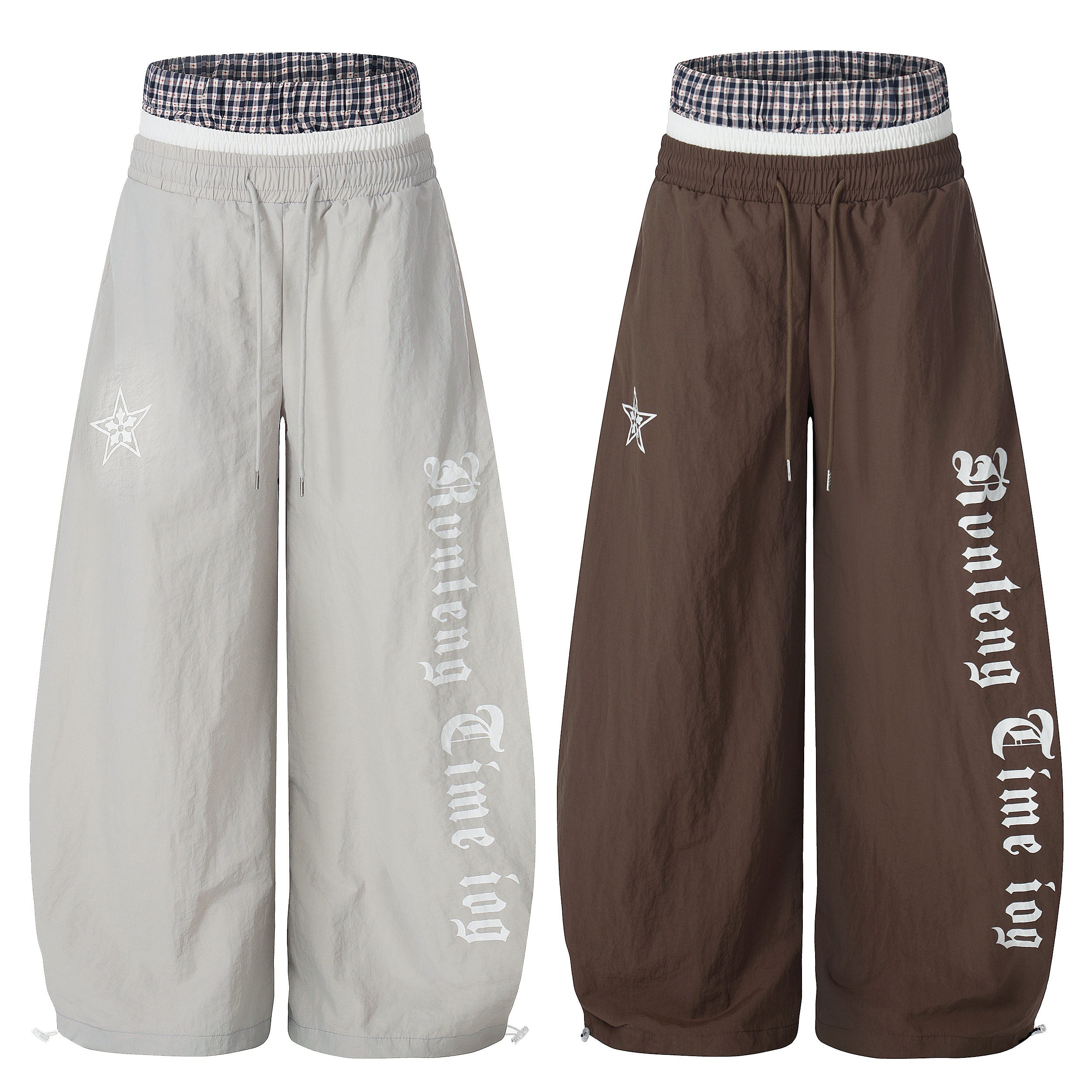 Light grey and dark brown wide-leg nylon pants with old-English script logo print, star graphic, and layered plaid waistband