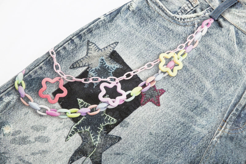 Back patchwork detail with pastel chain and star appliqué on light wash denim shorts