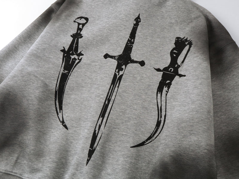 Close-up of gray hoodie back print with three black sword graphics on heather fabric