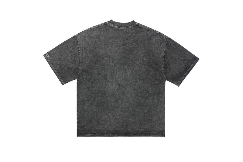 Vintage-washed black graphic tee with oversized fit, short sleeves, and faded streetwear finish, shown from the back