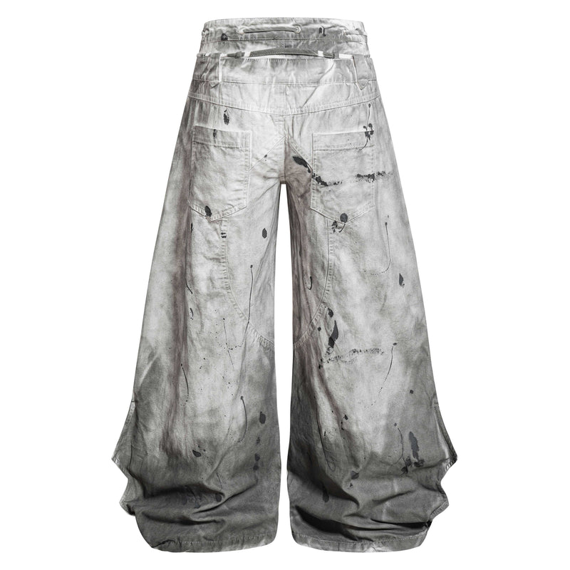 Back view of gray wide-leg jeans with splatter detailing and patch pockets