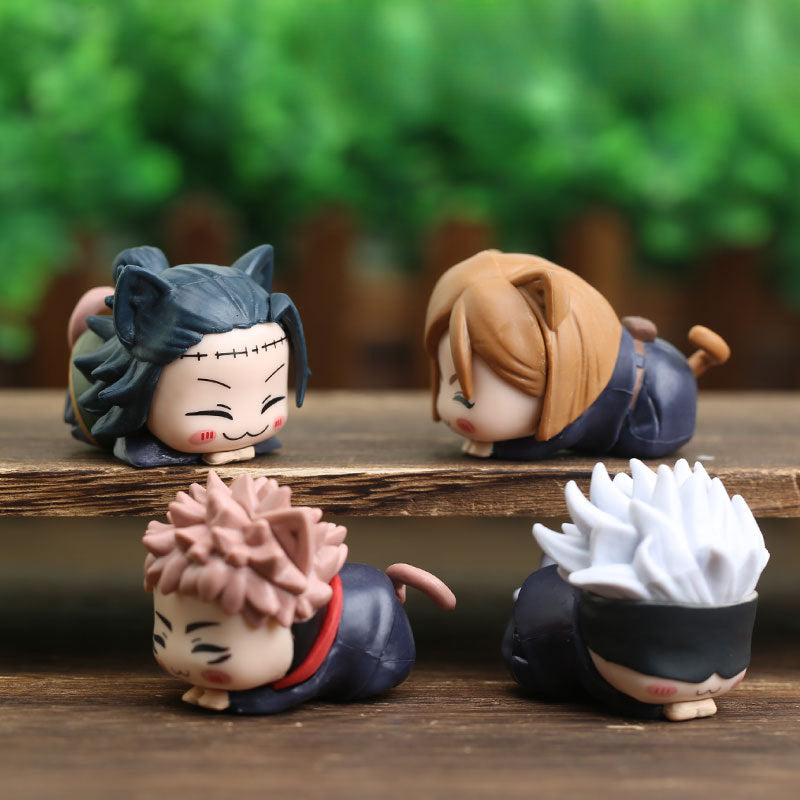 Four chibi figurines with animal ears rest on wooden steps, highlighting the kawaii charm of the Jujutsu Kaisen Chibi Figure Set – 4-Piece PVC Collection. Each 4 cm figure boasts unique hairstyles and expressions against a blurred green backdrop, perfect for anime merchandise collections!.