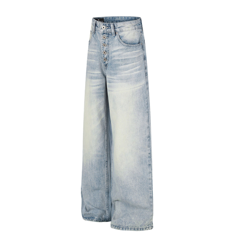 Light wash wide-leg jeans with button fly and curved front pockets, angled front view