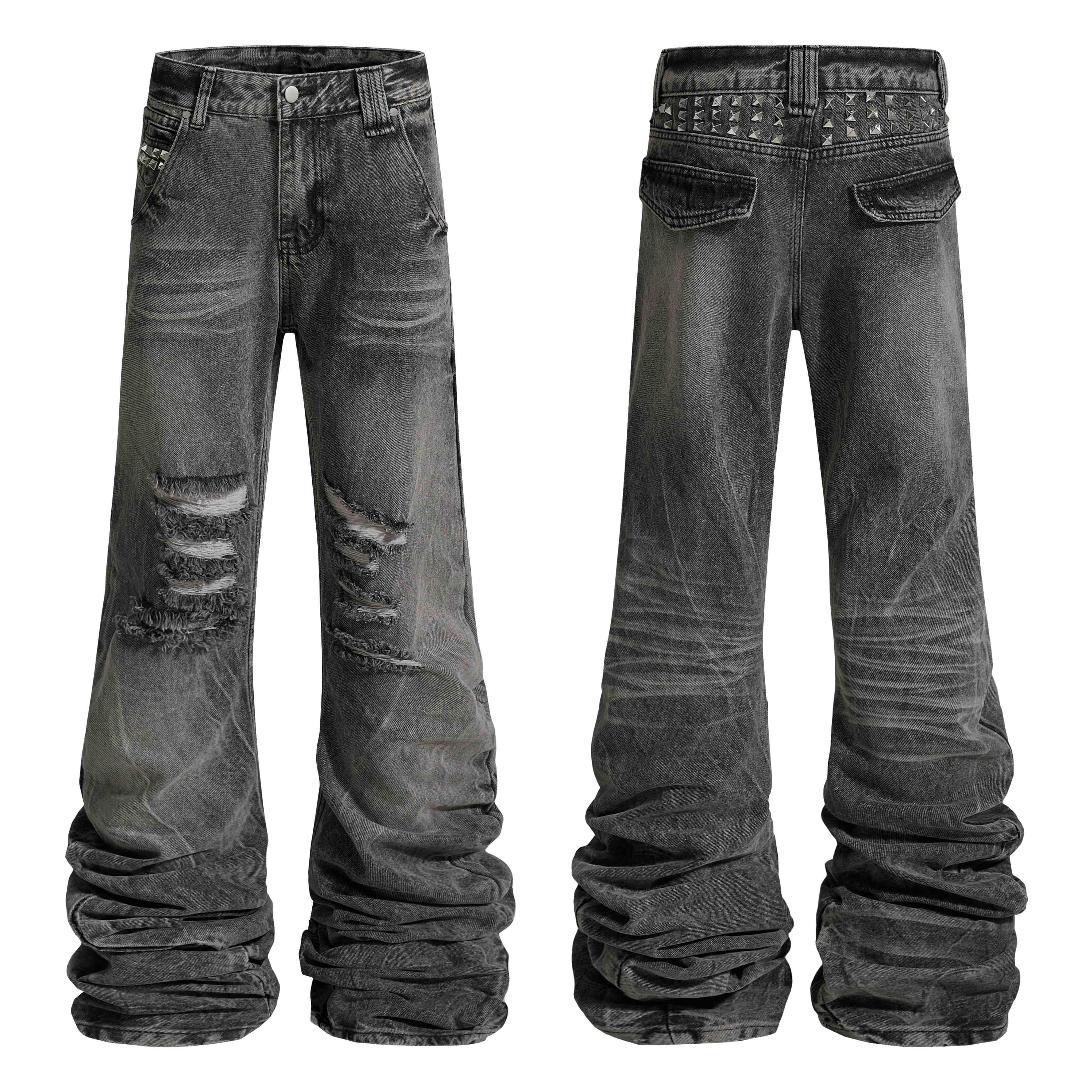 Front and back view of grey distressed studded stacked denim jeans with ripped knees and pyramid stud waistband
