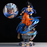 The Seakoff Goku Dual Head Collectible Figure features a dynamic Dragon Ball Z character in orange pants with Super Saiyan Blue and Ultra Instinct heads, including spiky black and silver hair. The 49cm figure stands on a decorative base with blue energy detailing.