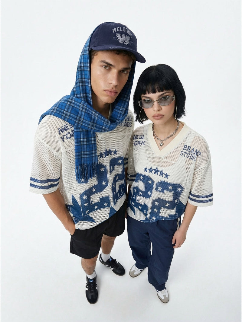 Two models wearing oversized blue and white mesh jersey tees with number 22 in varsity streetwear style