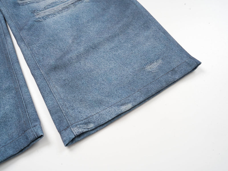 Close-up of a straight pant leg hem in blue denim print fabric