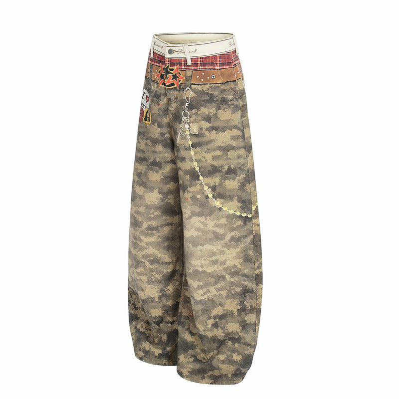 Three-quarter front view of wide-leg camouflage patchwork jeans with chain hanging down the leg