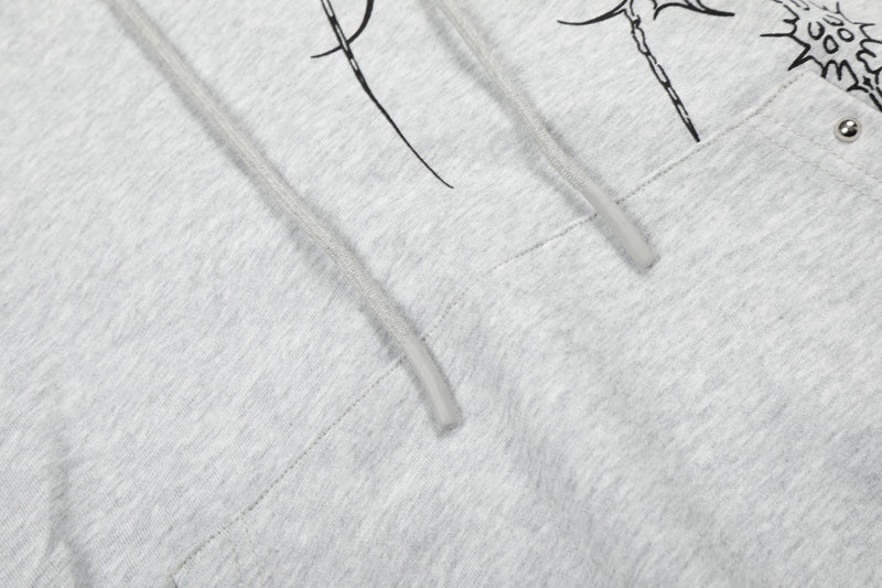 Close-up of light gray hoodie drawstrings and kangaroo pocket seam