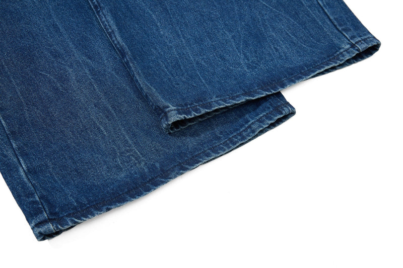 Folded wide-leg jeans hem in faded blue denim