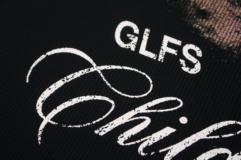 Black graphic tee with distressed white gothic lettering and abstract script print on textured fabric