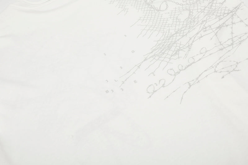 Close-up of white tee back graphic with faint gray abstract lines