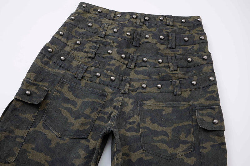 Close-up of stacked studded waist bands on camo cargo pants