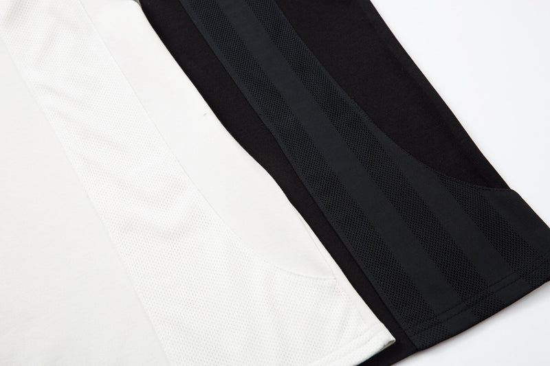 Mesh side panel and white body fabric detail on the raglan top