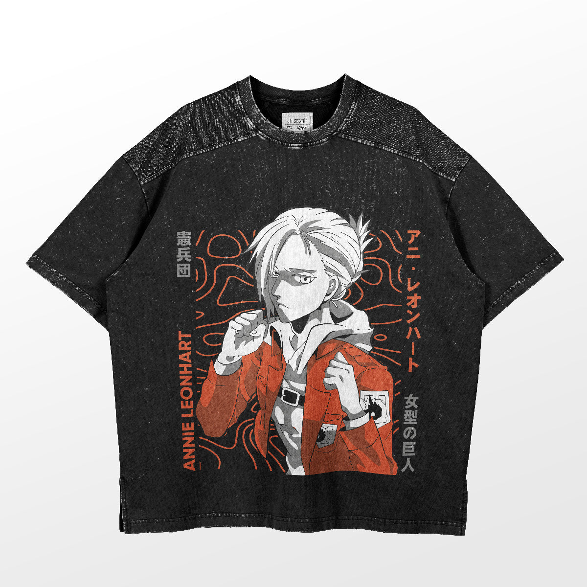 The Annie Leonhart T-Shirt from the Attack on Titan brand features her Female Titan transformation with a white-haired anime character in a red jacket, surrounded by Japanese text and orange abstract designs, and bold &quot;Annie Leonhart&quot; text on the left side.