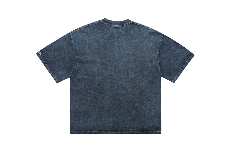 Dark washed oversized graphic tee with a relaxed fit, short sleeves, and streetwear-inspired denim texture on a white background