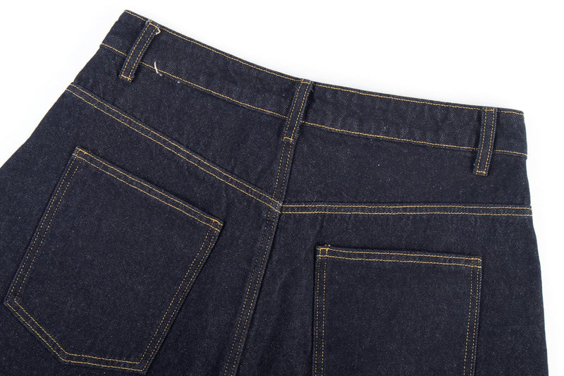 Back waistband close-up of dark jeans with belt loops and rear pockets