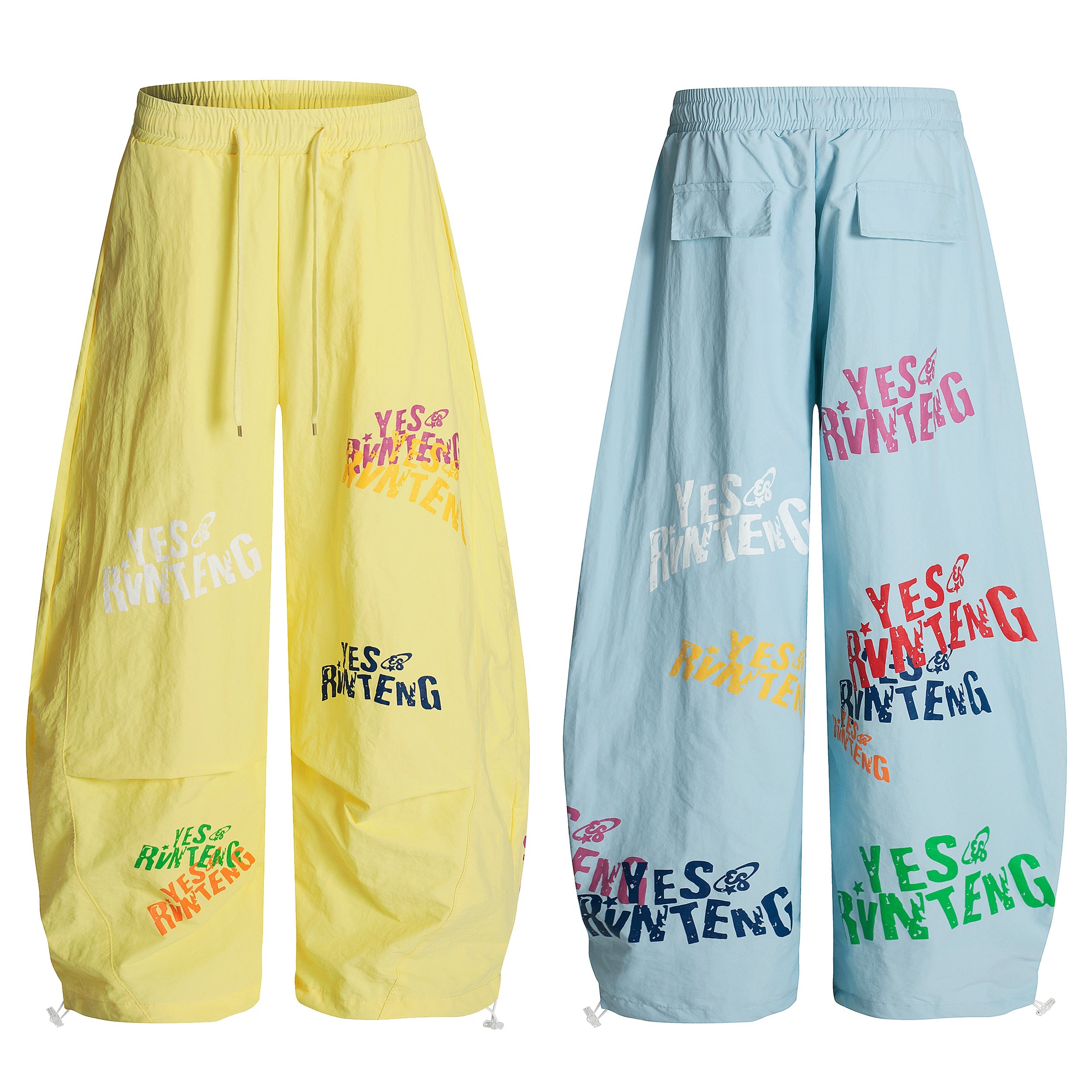 Omirad YES RVNTENG wide-leg nylon pants in pastel yellow and baby blue with multicolor logo prints, front and back views