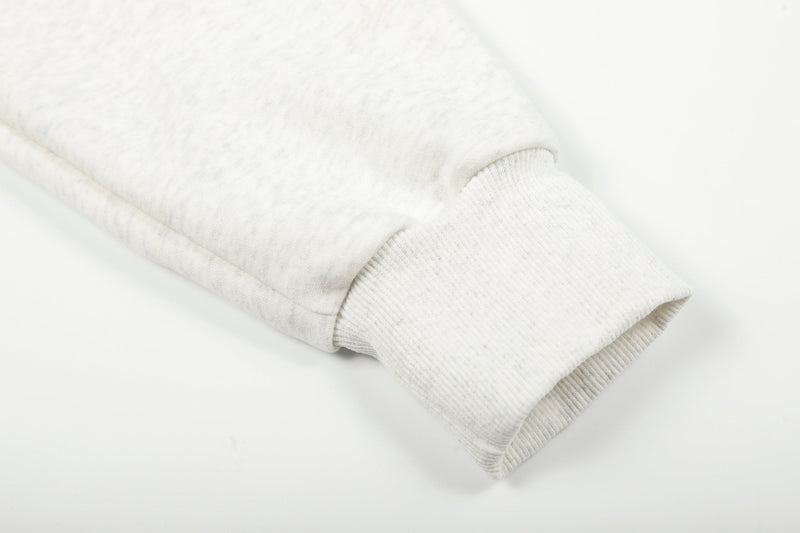 Close-up of white ribbed cuff on the hoodie sleeve