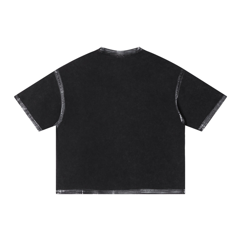 Black washed oversized T-shirt with faded white seam details and a minimal dark streetwear look