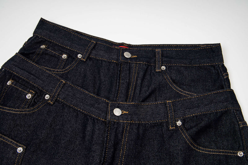 Close-up of top front denim waistband with double panel, button fly and stitching