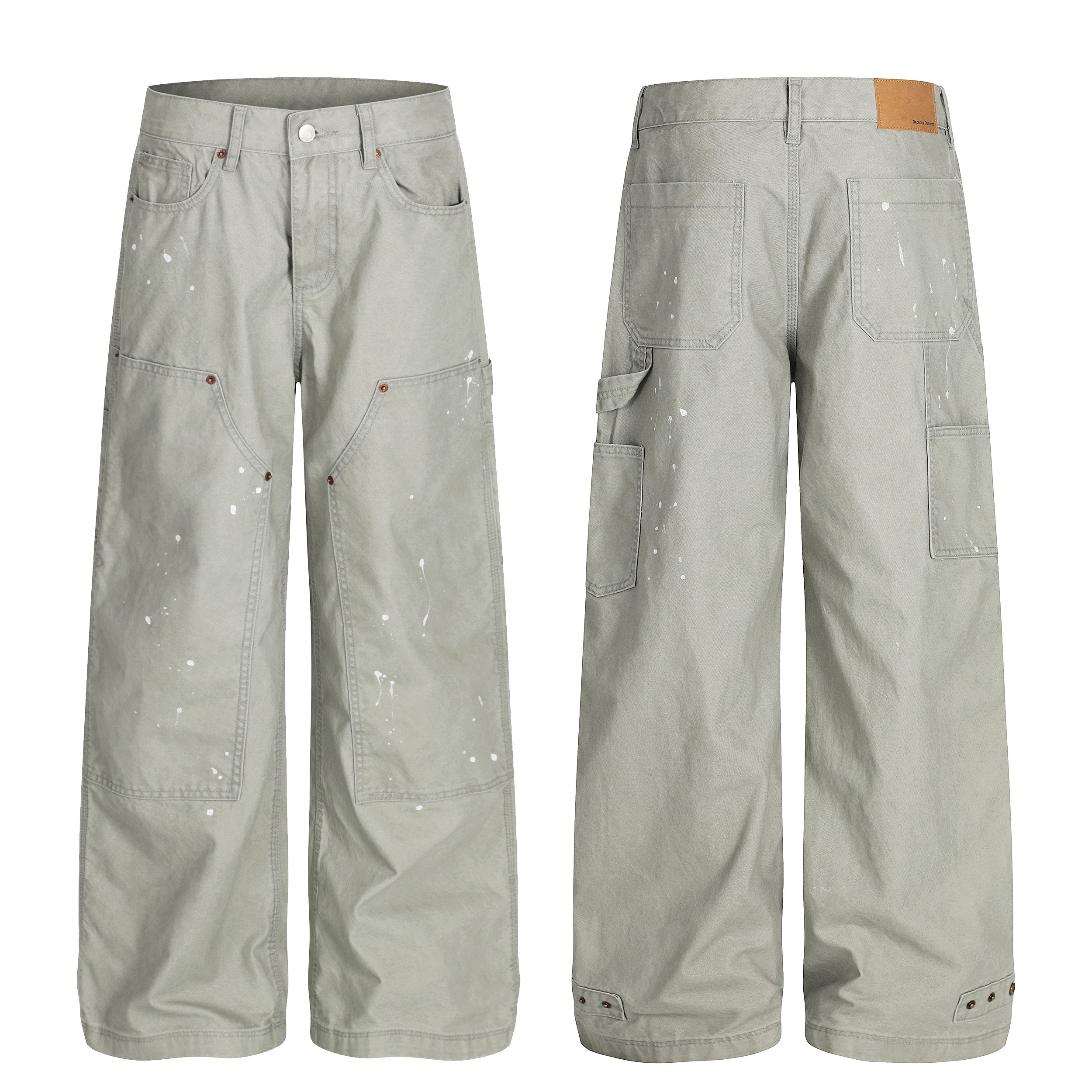 Front and back view of sage grey heavyweight cotton carpenter pants with white paint splatter and oversized patch pockets