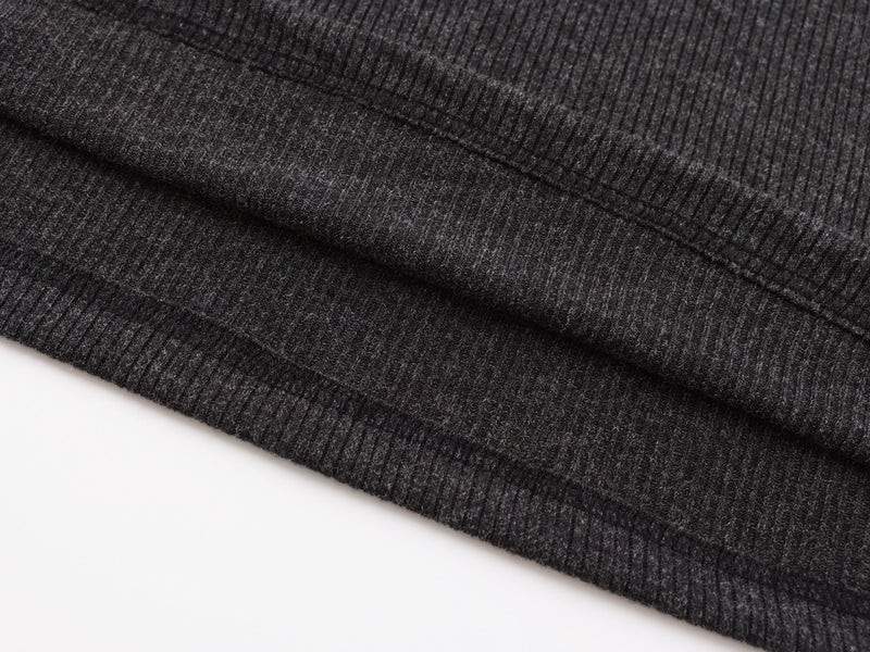 Close-up of black ribbed hem stitching and folded edge