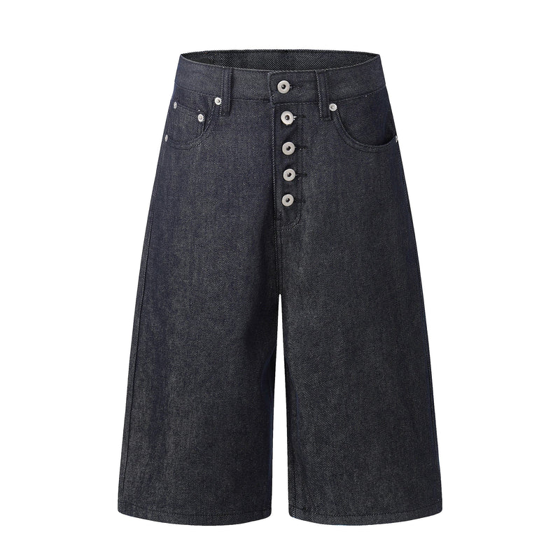 Dark wash wide-leg denim jorts with front button fly and raw longline hems