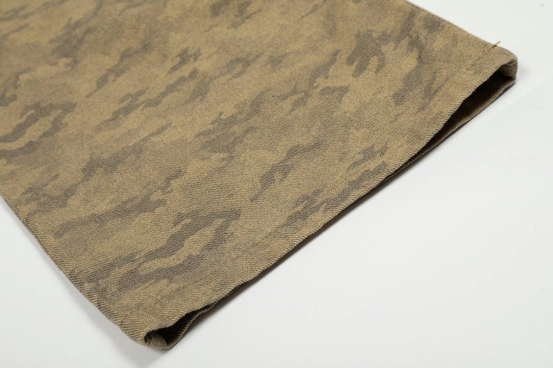 Close-up of wide-leg hem on desert camo cargo jeans