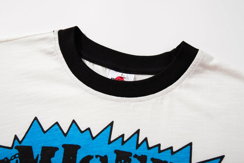White ringer tee with black collar and bold blue Misery Cat graphic print on the chest