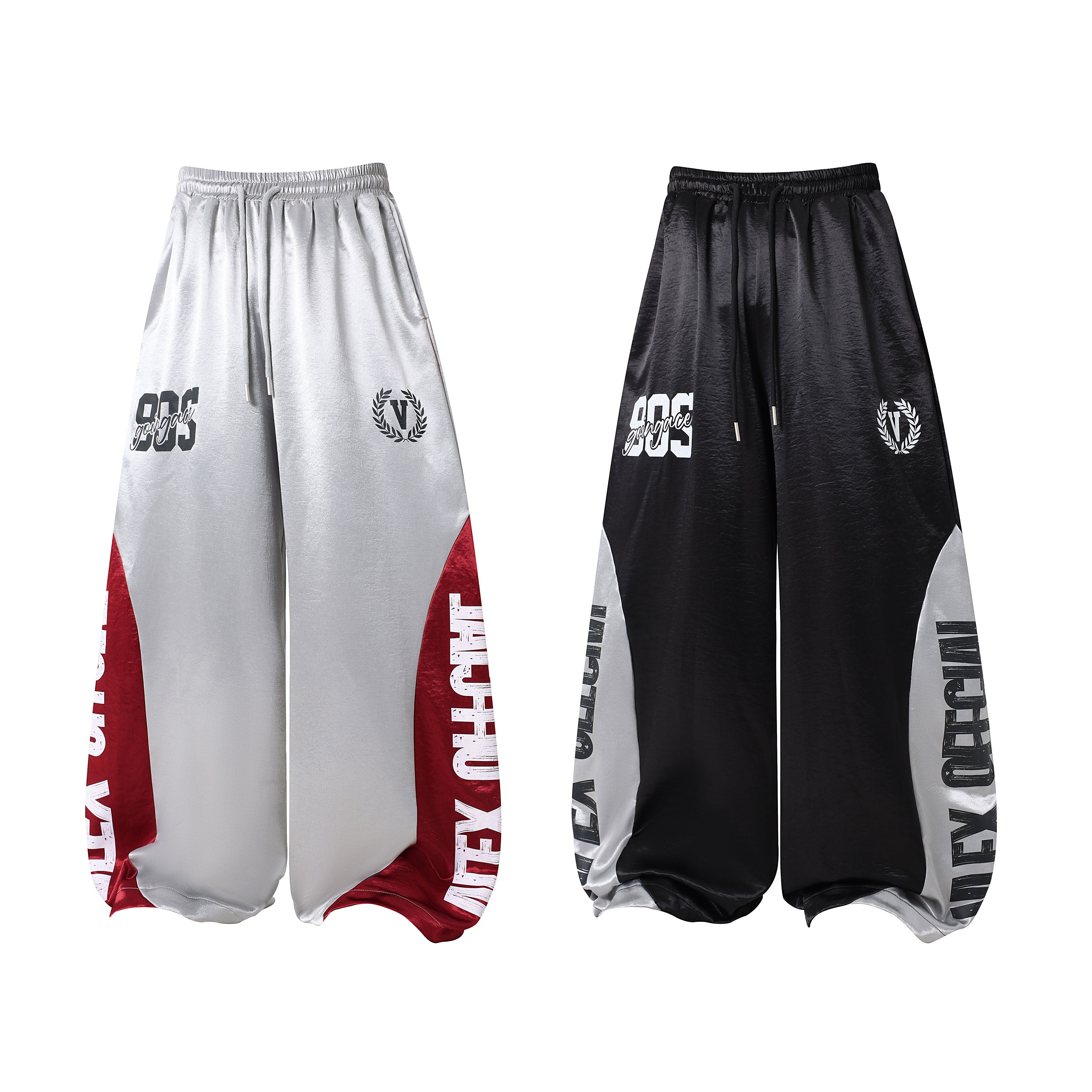 Silver-grey ultra wide-leg sweatpants with deep red contrast panels and varsity graphics, front view on white background