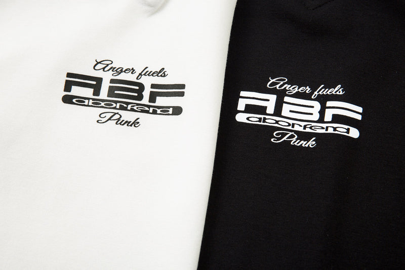 White and black chest logo print comparison on the raglan top
