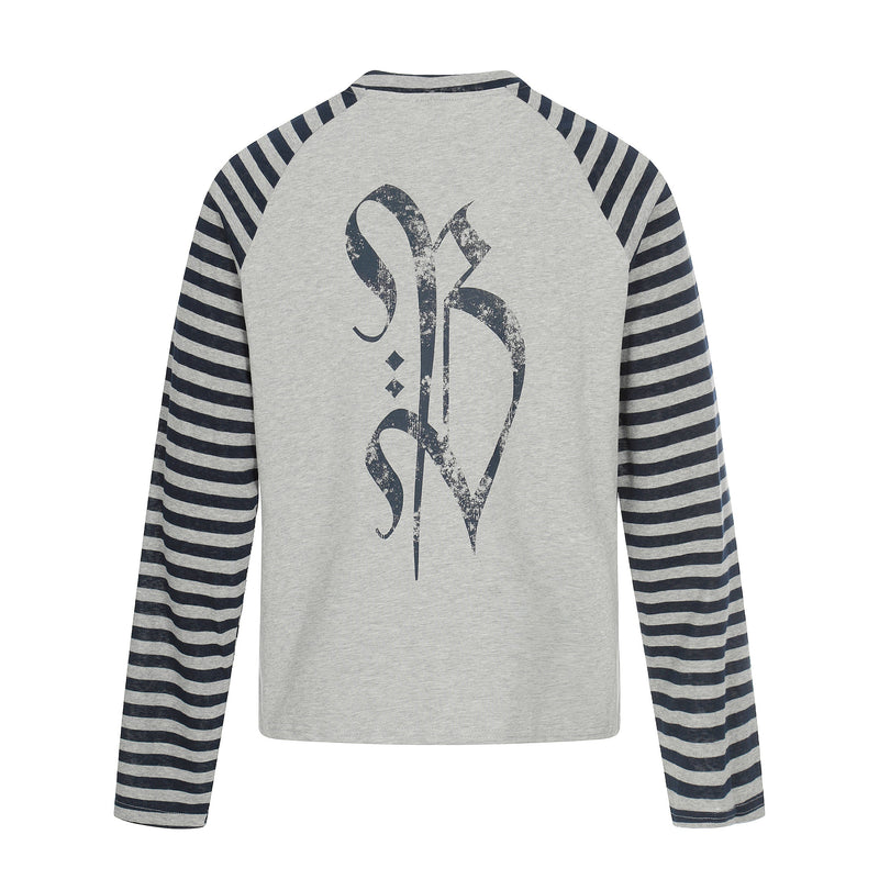 Back of gray raglan tee with navy striped sleeves and large gothic cross graphic