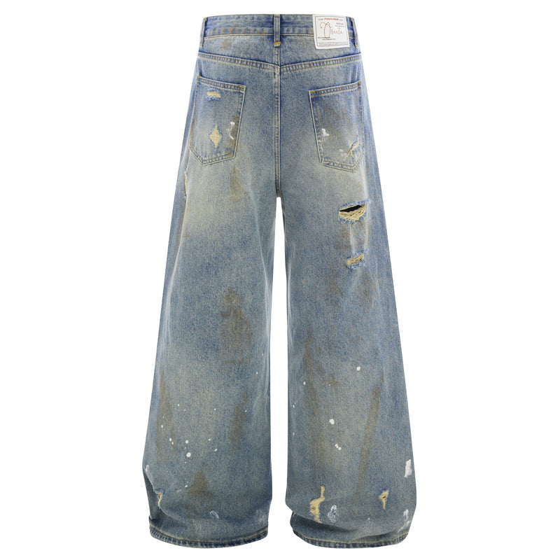 Back view of faded wide-leg jeans with patch pockets, distressing, and brand label