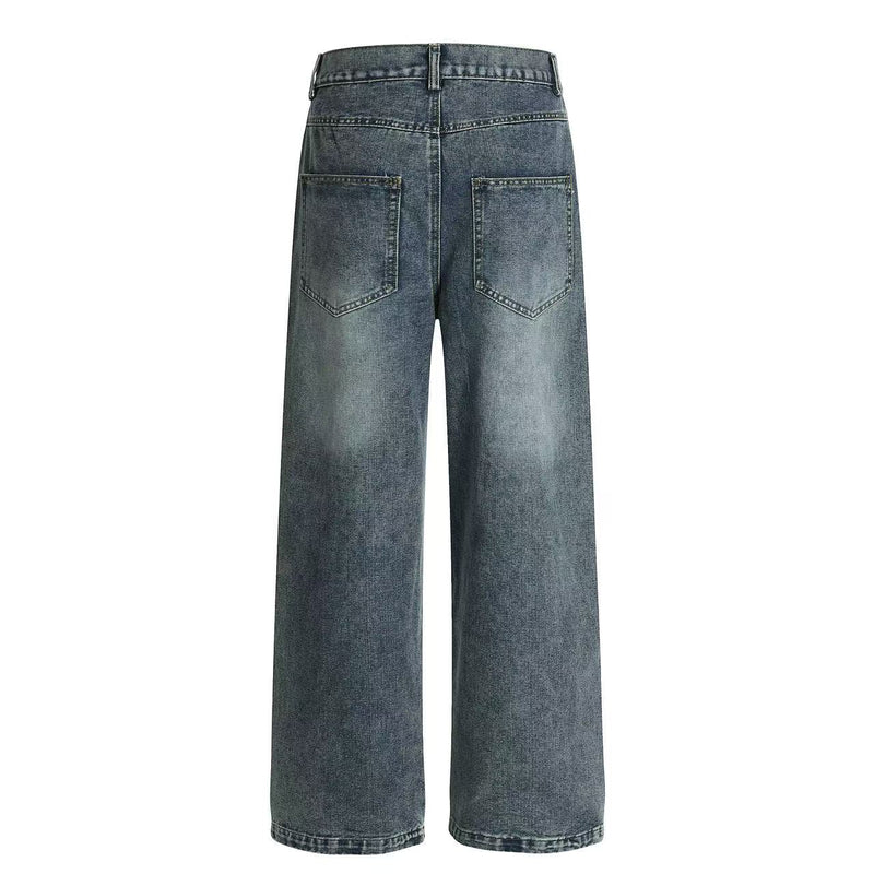 Back view of blue wide-leg denim jeans with two patch back pockets and faded wash