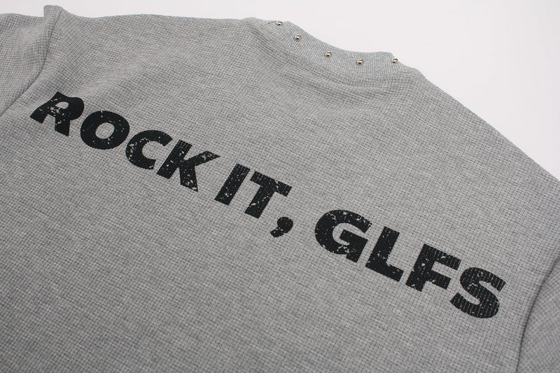 Gray textured graphic tee with distressed black Rock It, GLEES print and studded neckline detail