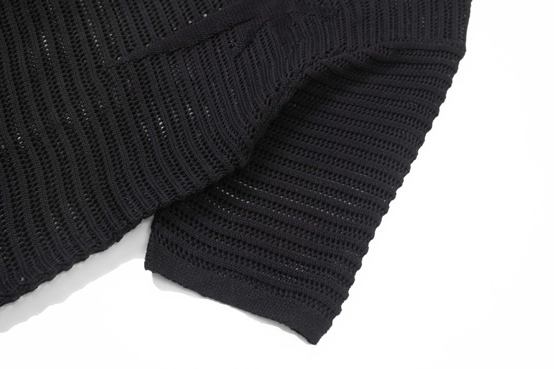 Black open-knit short-sleeve button-up shirt with textured mesh fabric and ribbed cuffs on a white background