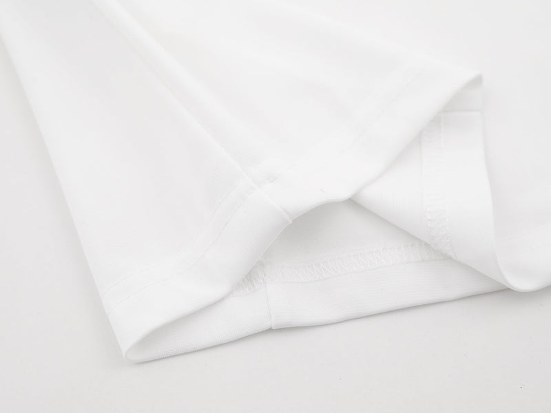 Close-up of white jersey hem and stitching