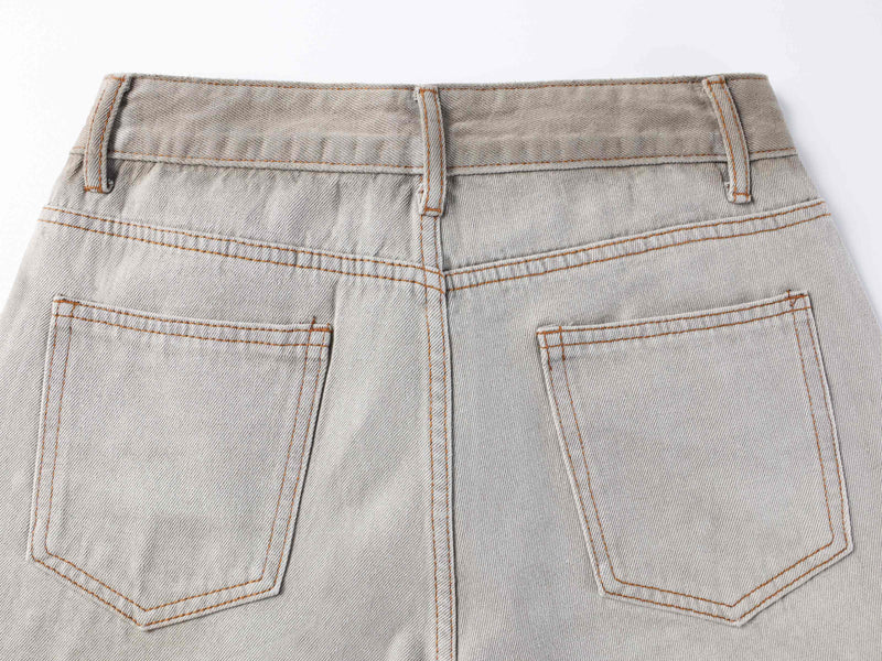 Back waistband and patch pockets on light gray washed balloon-fit denim pants