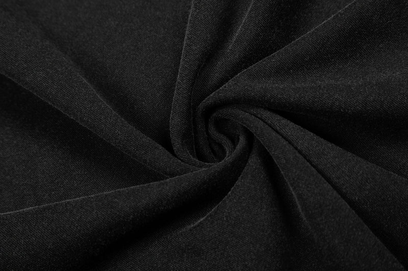 Close-up of black vintage washed T-shirt fabric with soft folds and textured cotton knit