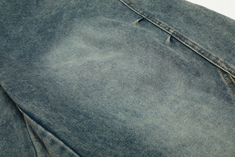 Close-up of faded blue denim thigh with seam detail