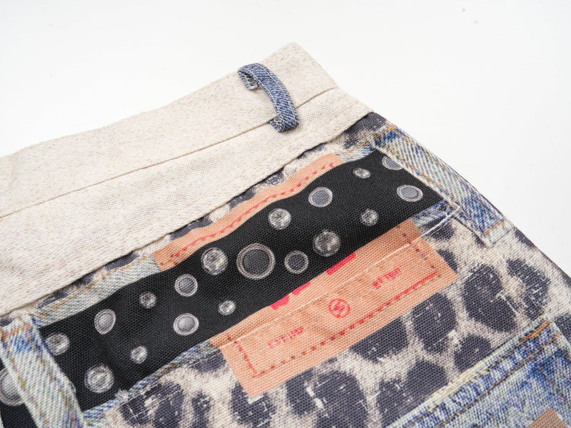Close-up of back waistband with black dotted panel and peach label detail